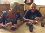 Mum and Dad trying to prise the caramel from the Pudim de Coco (coconut pudding)